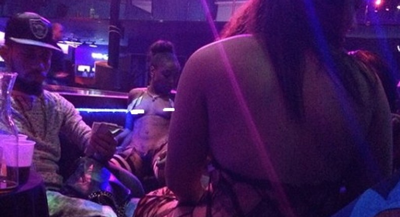 Rapper Phyno in the strip club 