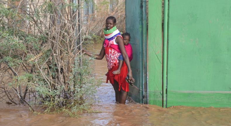 Some parts of northern Kenya received a year's worth of rain in a matter of weeks. A Turkana woman is shown here outside her home in the northwest