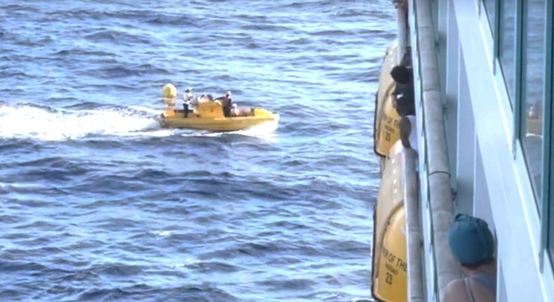 Passengers onboard Royal Caribbean's Mariner of the Sea watch as crew successfully rescued a woman who went overboard on Sunday.Courtesy of Matthew Kuhn