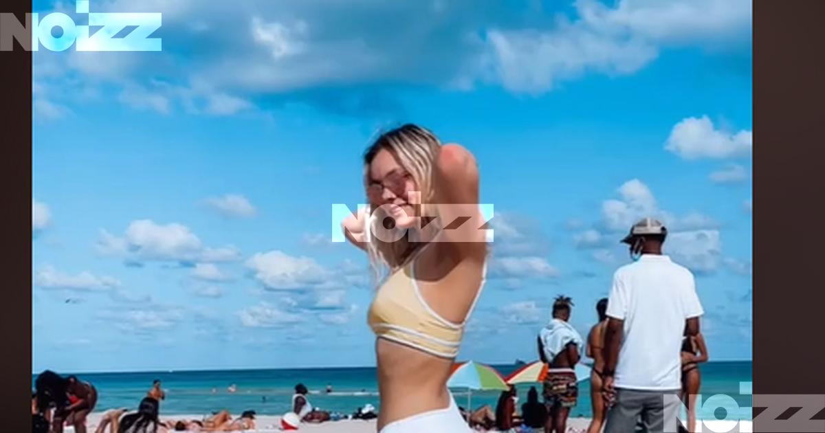 Egy cuki fotót akart a strandon a fiatal lány, de egy belógó testrész  kellemetlen meglepetés okozott