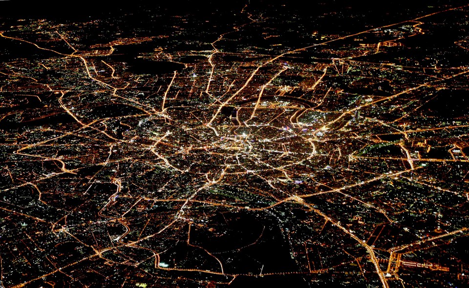 A general view of night Moscow is seen from the window of a passenger jet