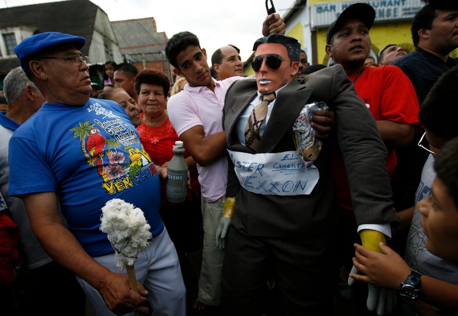 A model called "Mr. Exxon" is hung before being burnt during Easter Sunday celebrations in Caracas, March 23, 2008. In Venezuela, people burn this "Judas" every year representing a political situation. A week prior, a British judge lifted a $12 billion freeze on Venezuelan assets awarded to US oil major Exxon Mobil in a spat over a seized oil project.