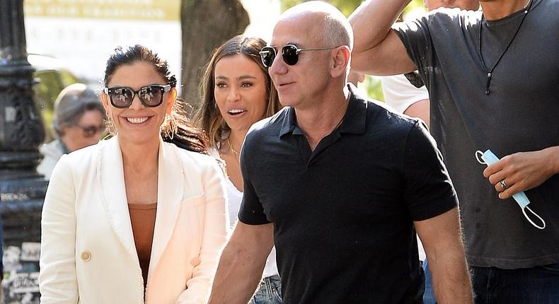 Amazon tycoon Jeff Bezos and his girlfriend Lauren Sanchez were pictured putting on a very public display of affection on a busy New York City street on Friday.