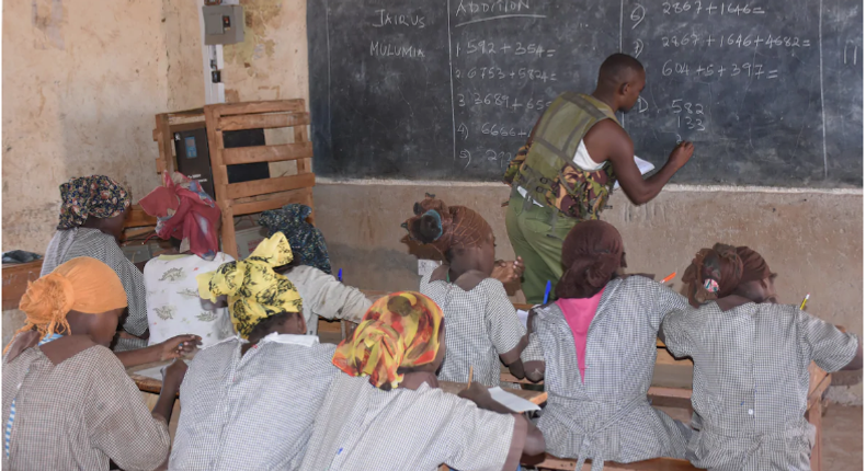 Police officer dumps his gun to teach mathematics as teachers fail to show up over insecurity