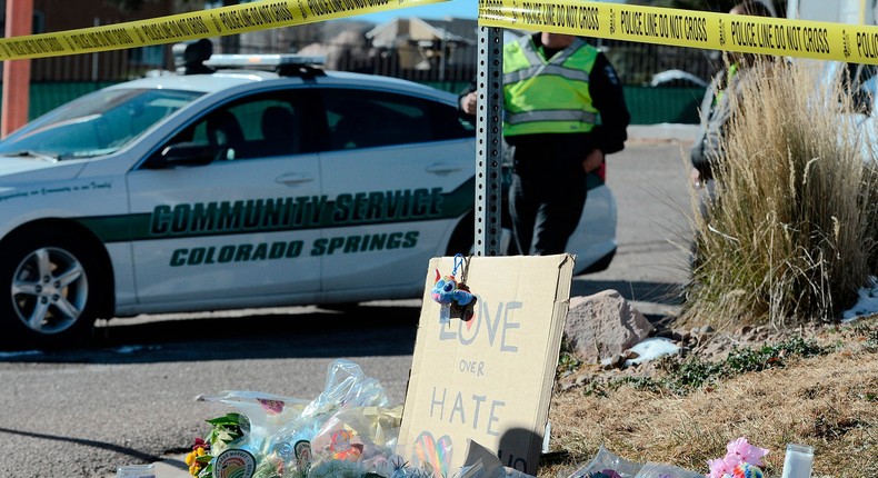 A bouquet of flowers is left near Club Q, an LGBTQ nightclub in Colorado Springs, Colorado, on November 20, 2022.(Photo by Jason Connolly / AFP)