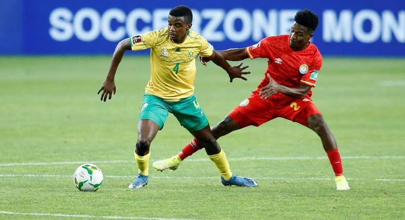 Teboho Mokoena (L) of South Africa and Suteman Hamid (R) of Ethiopia contest possession during a World Cup qualifier in Johannesburg on Tuesday. Creator: Phill Magakoe