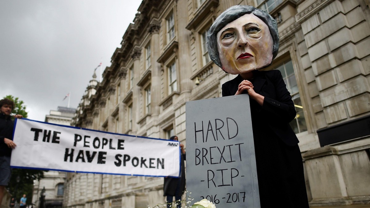 Protestor wearing a Theresa May mask is seen the day after Britain's election in London