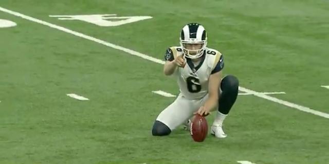 Rams punter stares down the camera and pulls off a no-look hold in