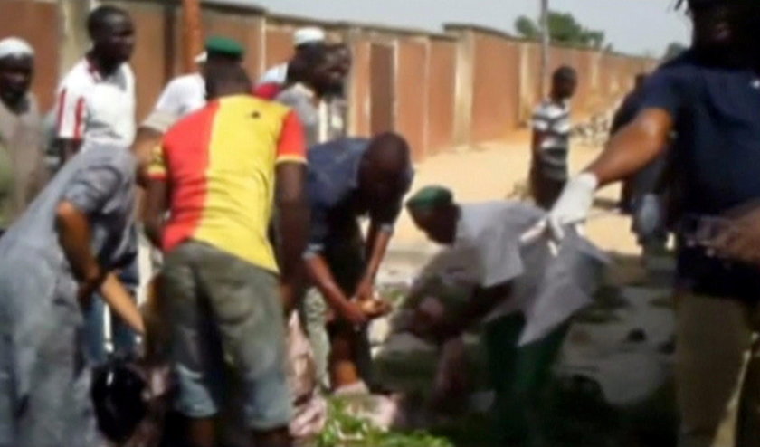 Still image taken from a video shows a blood stain at blast attack site in Mubi