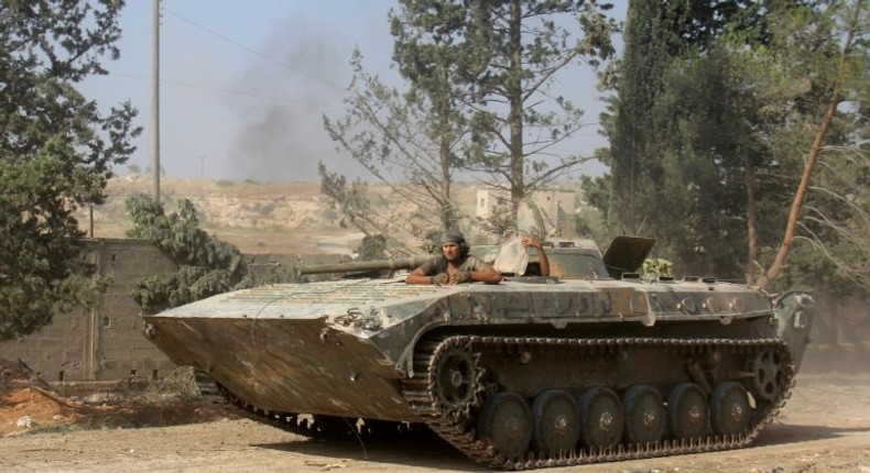 Fighters from Fateh al-Sham Front take positions south of Aleppo in August 2016 during an offensive to break the government siege of the city