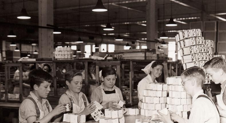 Boys folding boxes for Rowntrees Nux Chocolates in the packing department, Rowntree factory, York. Yorkshire, 1940. (Photo by Borthwick Institute/Heritage Images/Getty Images)Heritage Images