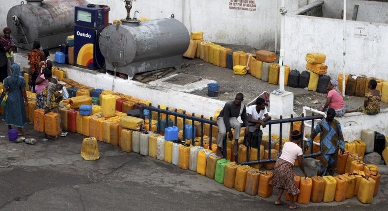 Plastic containers are arranged at a fuel station as people wait to buy kerosene in Nigeria's commercial capital Lagos, in this June 9, 2011 file photo. REUTERS/Akintunde Akinleye/Files