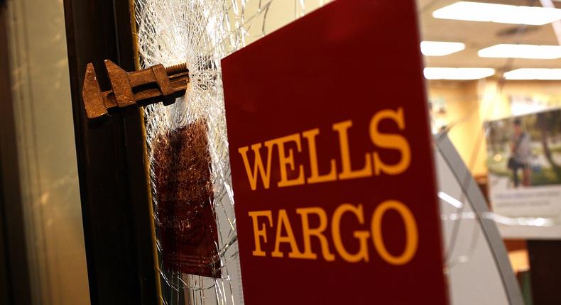 A pipe wrench is embedded in the window of a Wells Fargo bank after an Occupy protester smashed it during a May Day demonstration on May 1, 2012 in Oakland, California.