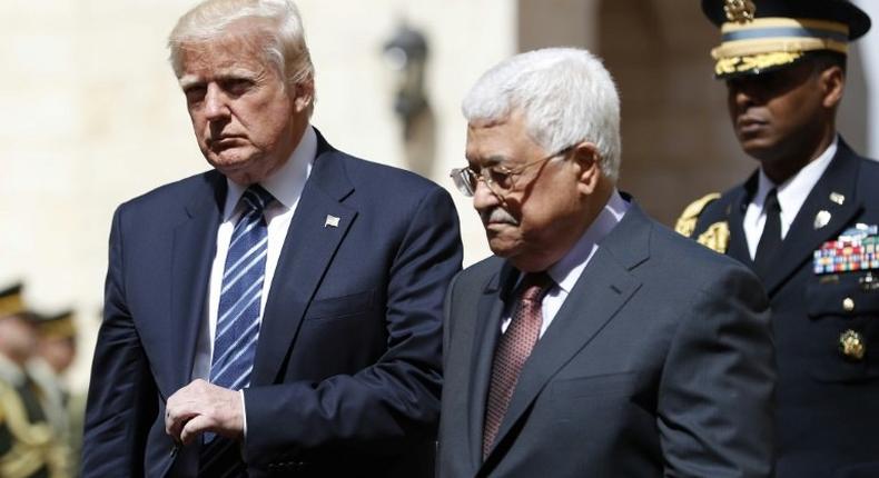 US President Donald Trump (L) is welcomed by Palestinian leader Mahmud Abbas at the presidential palace in the West Bank city of Bethlehem on May 23, 2017