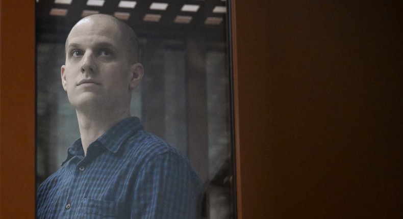 Evan Gershkovich, a US journalist accused of espionage, looks out from inside a glass defendants' cage prior to a hearing in Yekaterinburg's Sverdlovsk Regional Court.NATALIA KOLESNIKOVA/AFP via Getty Images