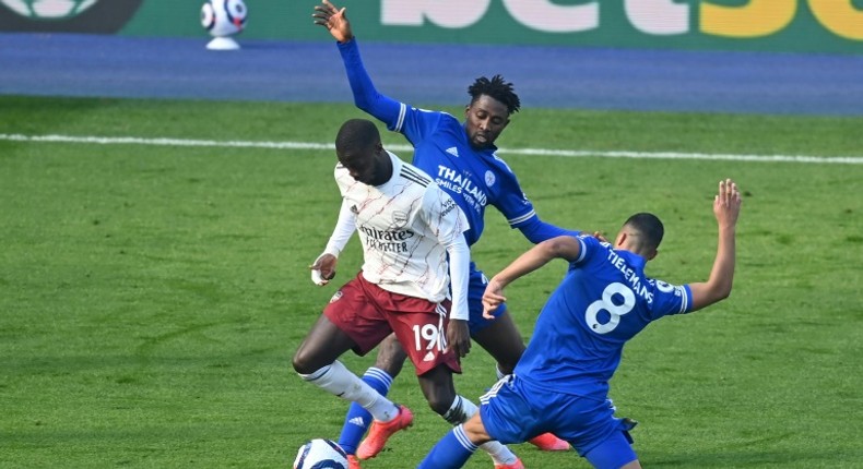 Arsenal winger Nicolas Pepe (L) is fouled during his outstanding performance against Leicester City at the weekend