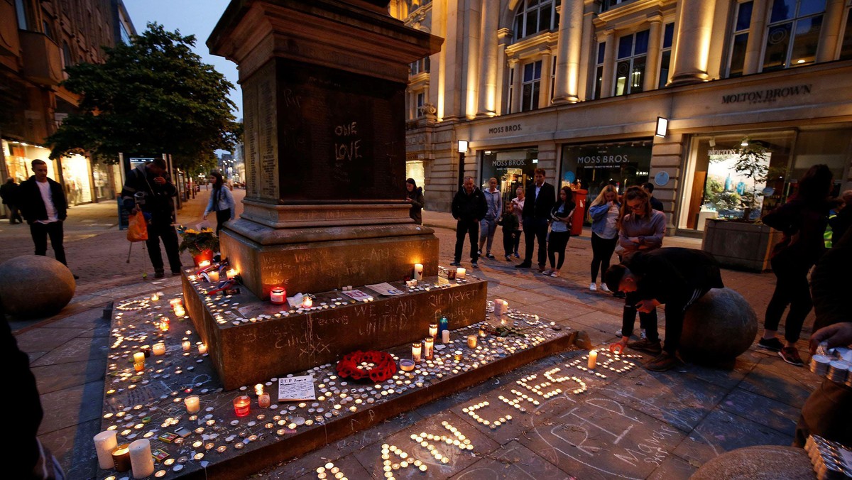 People attend a vigil for the victims of last week's attack at a pop concert at Manchester Arena, in