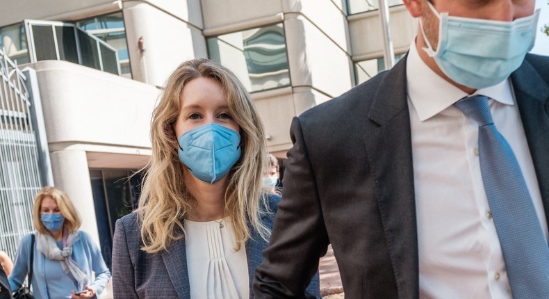 Elizabeth Holmes, founder and former CEO of blood testing and life sciences company Theranos, leaves the courthouse with her husband Billy Evans after the first day of her fraud trial in San Jose, California on September 8, 2021.
