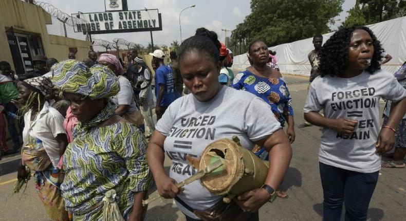 Some 2,000 of people, including women and children, trekked to state Governor Akinwumi Ambode's office, barricading its doors and saying they planned to rally until their demands were met