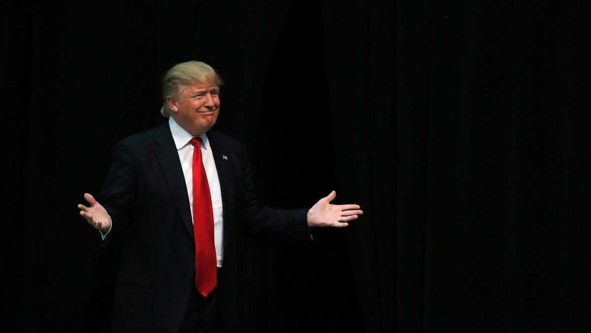 U.S. Republican presidential candidate Trump reacts as he is introduced during a campaign event in C