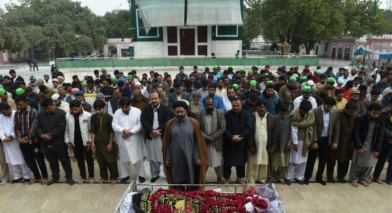 Pakistani relatives and residents offer funeral prayers for a blast victim during a ceremony in Lahore on February 14, 2017