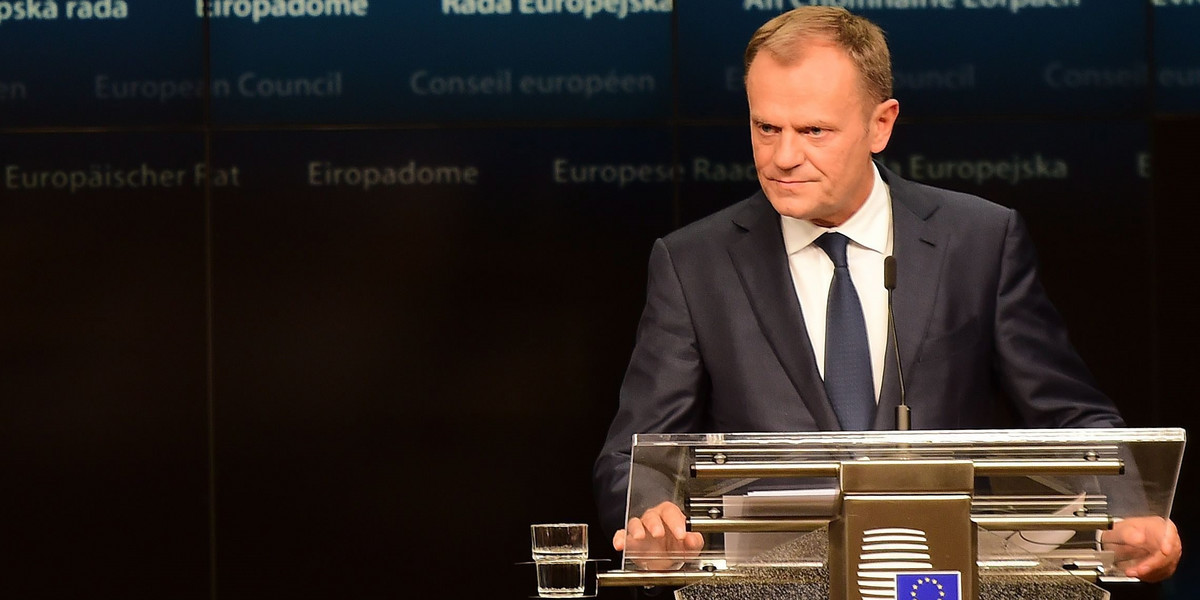 EU Council President Tusk listens to Luxembourg's PM Bettel at the start of the Tripartite Social Summit ahead of an EU leaders meeting in Brussels