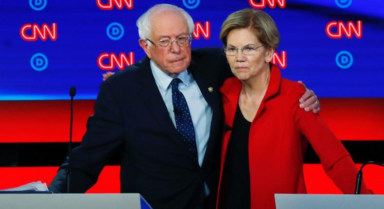 Sens. Bernie Sanders and Elizabeth Warren embrace at at July 2019 Democratic debate.