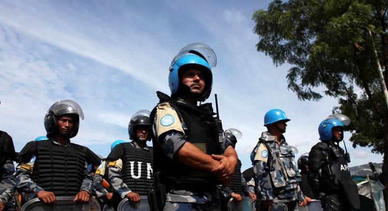 U.N. peacekeepers stand guard during a visit by U.N. Secretary-General Ban Ki-moon to an IDP (internally displaced persons) camp in the United Nations Mission In South Sudan (UNMISS) base in Juba May 6, 2014. REUTERS/Andreea Campeanu