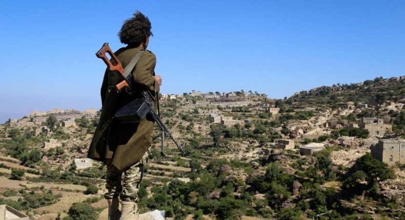 A Yemeni tribesman from the Popular Resistance Committee, supporting forces loyal to Saudi-backed President Abedrabbo Mansour Hadi, stands on a hill in the central city of Taiz, on November 1, 2016