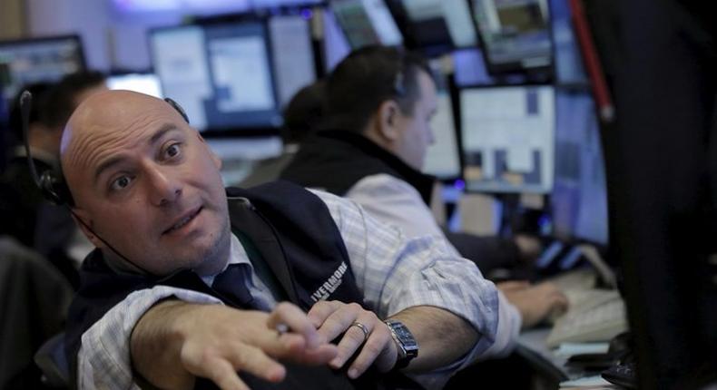 Traders work on the floor of the NYSE