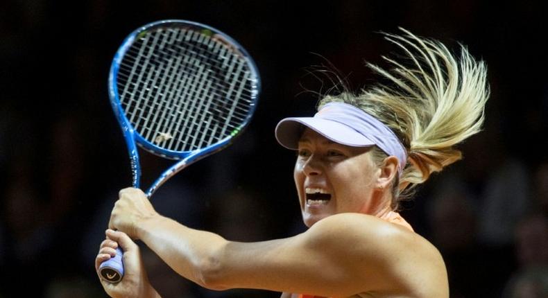 Russia's Maria Sharapova returns to France's Kristina Mladenovic during their semifinal match at the WTA Porsche Tennis Grand Prix in Stuttgart on April 29, 2017