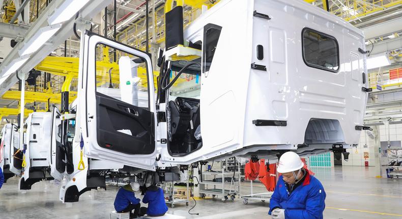 Workers are producing a BYD new energy commercial vehicle at a workshop in Huai'an, China, on January 11, 2024.Costfoto/NurPhoto/Getty Images