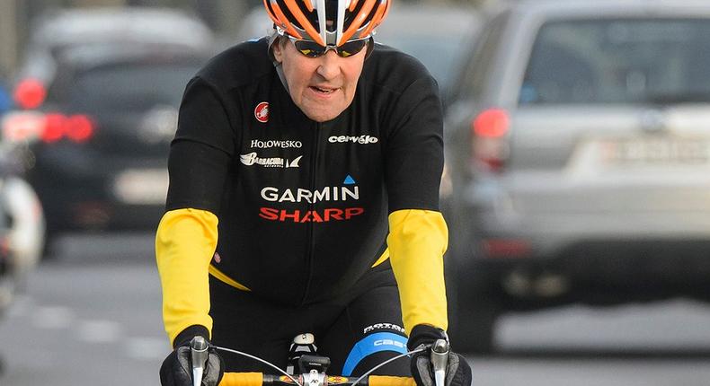 U.S. Secretary of State John Kerry, rides a bike after holding meetings with Iranian Foreign Minister Mohammad Javad Zarif over Iran's nuclear program, in Lausanne, Switzerland, Monday, March 16, 2015. 