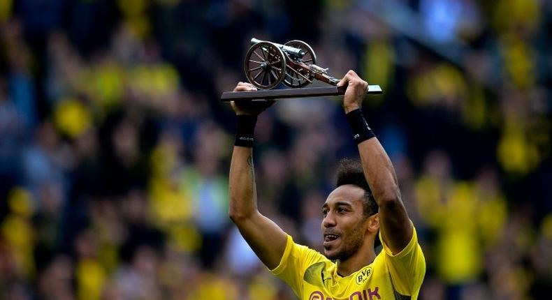 Dortmund's Pierre-Emerick Aubameyang lifts the trophy as the Bundesliga's top-scorer after the German first division football match against Werder Bremen on May 20, 2017