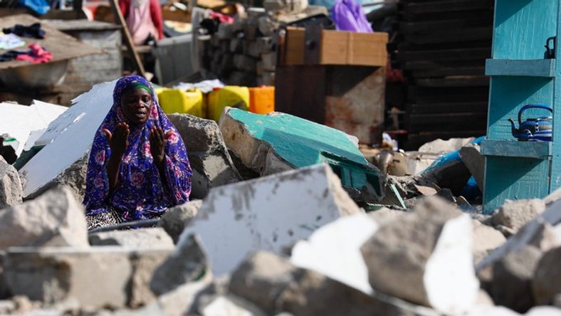 Muslim prays in demolished mosque