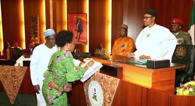 President Muhammadu Buhari swears in Head of Service, Winifred Oyo-Ita in Abuja on January 6, 2016