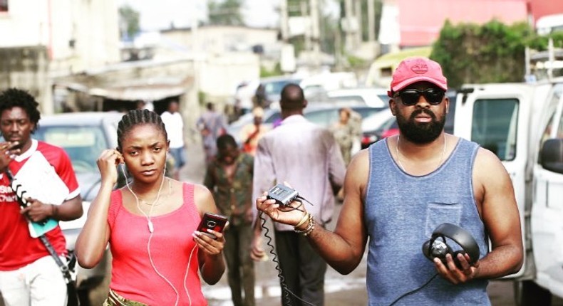 Simi and Kunle Afolayan on the set of 'Mokalik.' [Instagram/kunleafo]