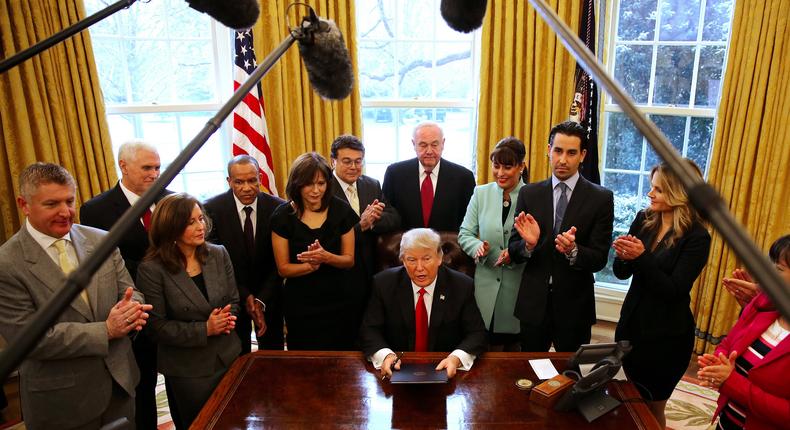 President Trump signs an executive order at the White House.