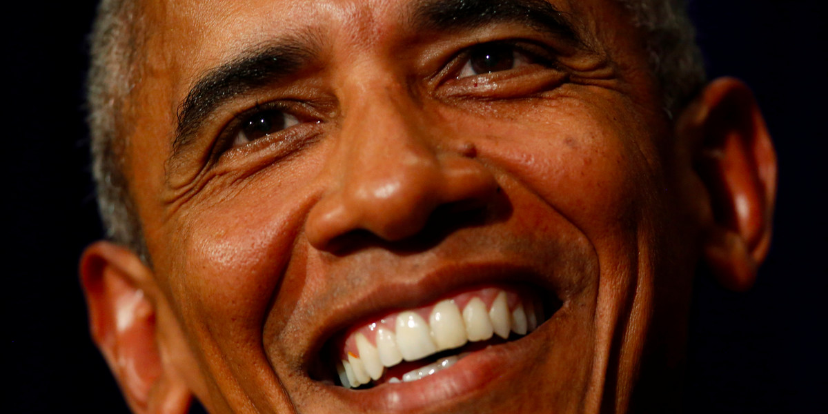 President Barack Obama laughs during a press conference in Laos.