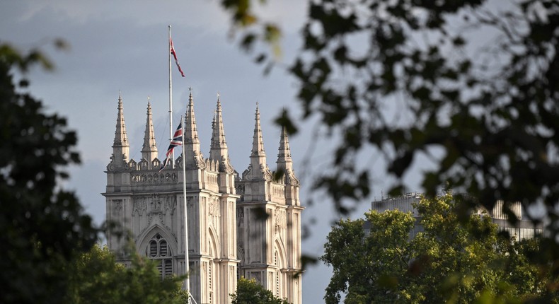 The Britain national flag flies full mast, after the Proclamation of the new King, at Westminster Abbey on September 10, 2022, two days after Queen Elizabeth II died at the age of 96. - King Charles III pledged to follow his mother's example of lifelong service in his inaugural address to Britain and the Commonwealth on Friday, after ascending to the throne following the death of Queen Elizabeth II on September 8.