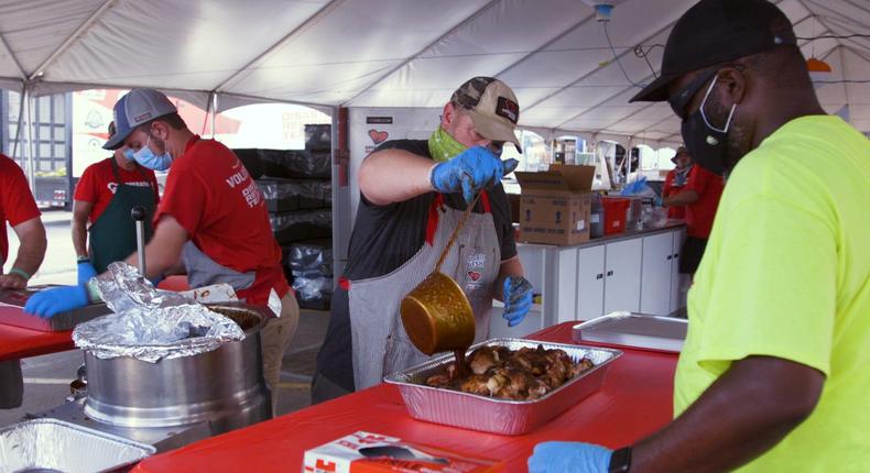 Volunteers with Operation BBQ Relief preparing chicken to distribute to Hurricane Laura victims in Lake Charles, Louisiana.