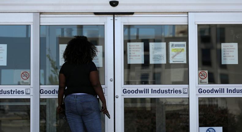 FILE PHOTO: A woman looks for information on the application for unemployment support at the New Orleans Office of Workforce Development, as the spread of coronavirus disease (COVID-19) continues, in New Orleans, Louisiana U.S., April 13, 2020. REUTERS/Carlos Barria