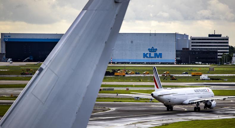 A KLM hangar and Air France and KLM planes at Schipol airport.