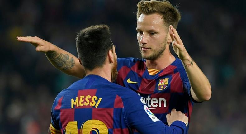 Barcelona's Croatian midfielder Ivan Rakitic (right) has sustained an Achilles injury.