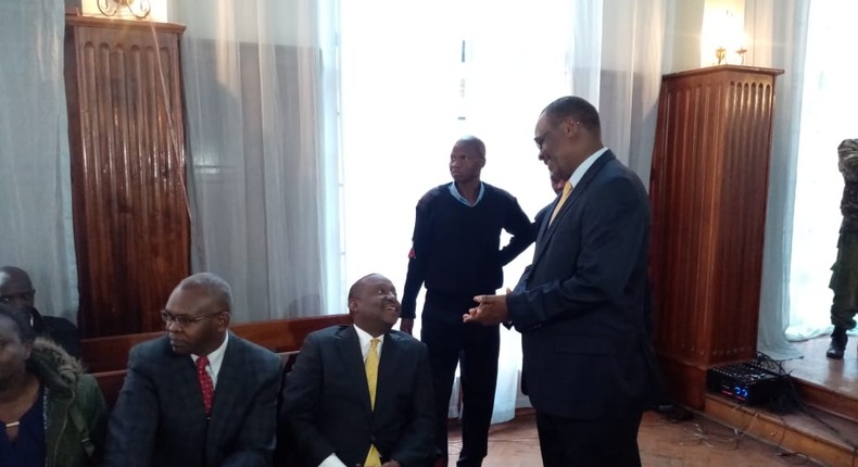 Former Nairobi Governor Evans Kidero consoles Treasury CS Henry Rotich 