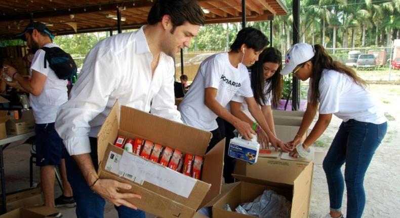Alfred Santamaria packs medical supplies to send to protesters in Venezuela at the Solidaridad Venezuela event in Hialeah, Florida on May 13, 2017