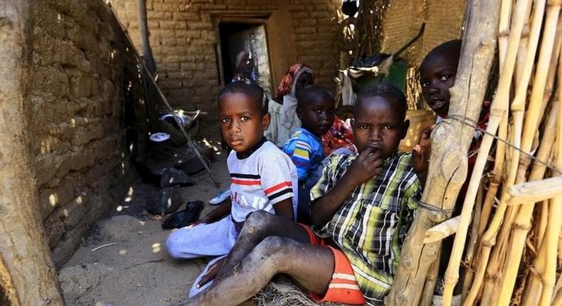 Internally displaced children sit inside their shelter in Kalma camp in Nyala, South Darfur, Sudan, November 22, 2015. REUTERS/Mohamed Nureldin Abdallah