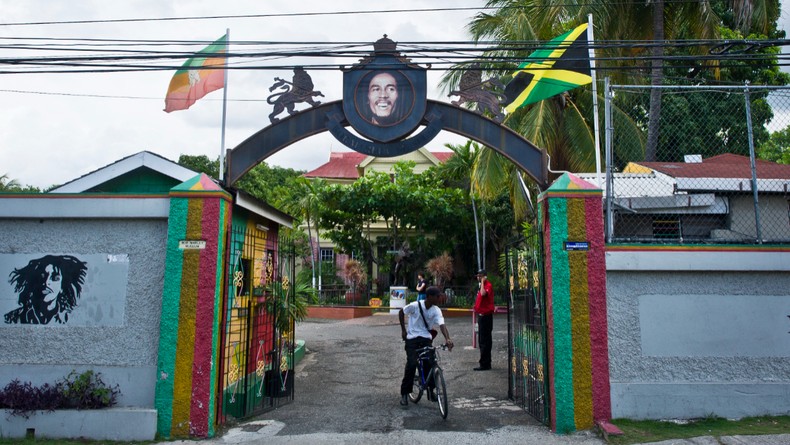 An arch depicting Jamaican Reggae legend Bob Marley welcomes visitors to his museum in Kingston on June 30, 2012. Jamaica will celebrate its 50th anniversary as an independent state on August 6, 2012.  [Photo by MLADEN ANTONOV/AFP via Getty Images]