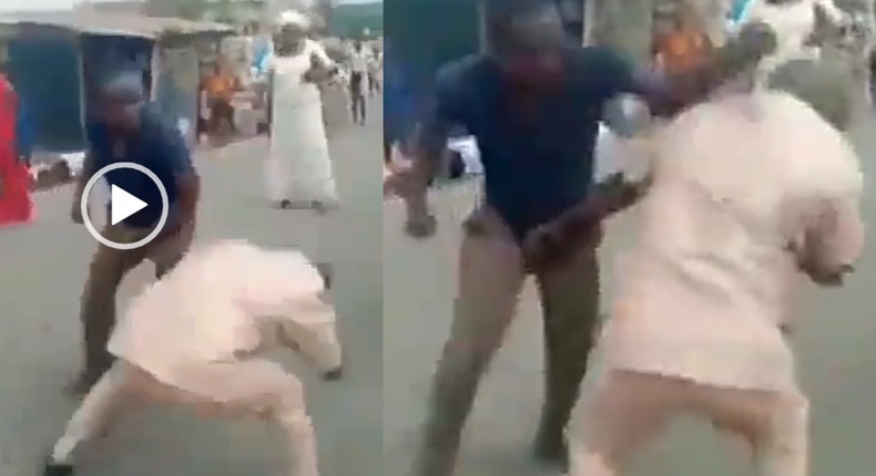 Two grown ‘gentlemen’ fight in the middle of the street over woman (video)