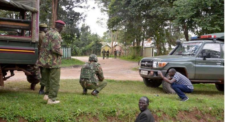 Kenyan police officers hold their position during the deadly shooting at the Kapenguria police station in July. A police officer over the weekend shot dead his female colleague at Marimanti Police Station, Tharaka Nithi County.
